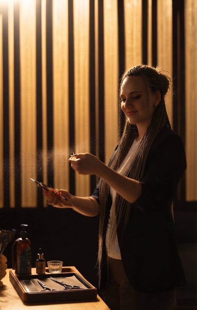 The studio on Dundas St W, lit warm behind the braiding chair